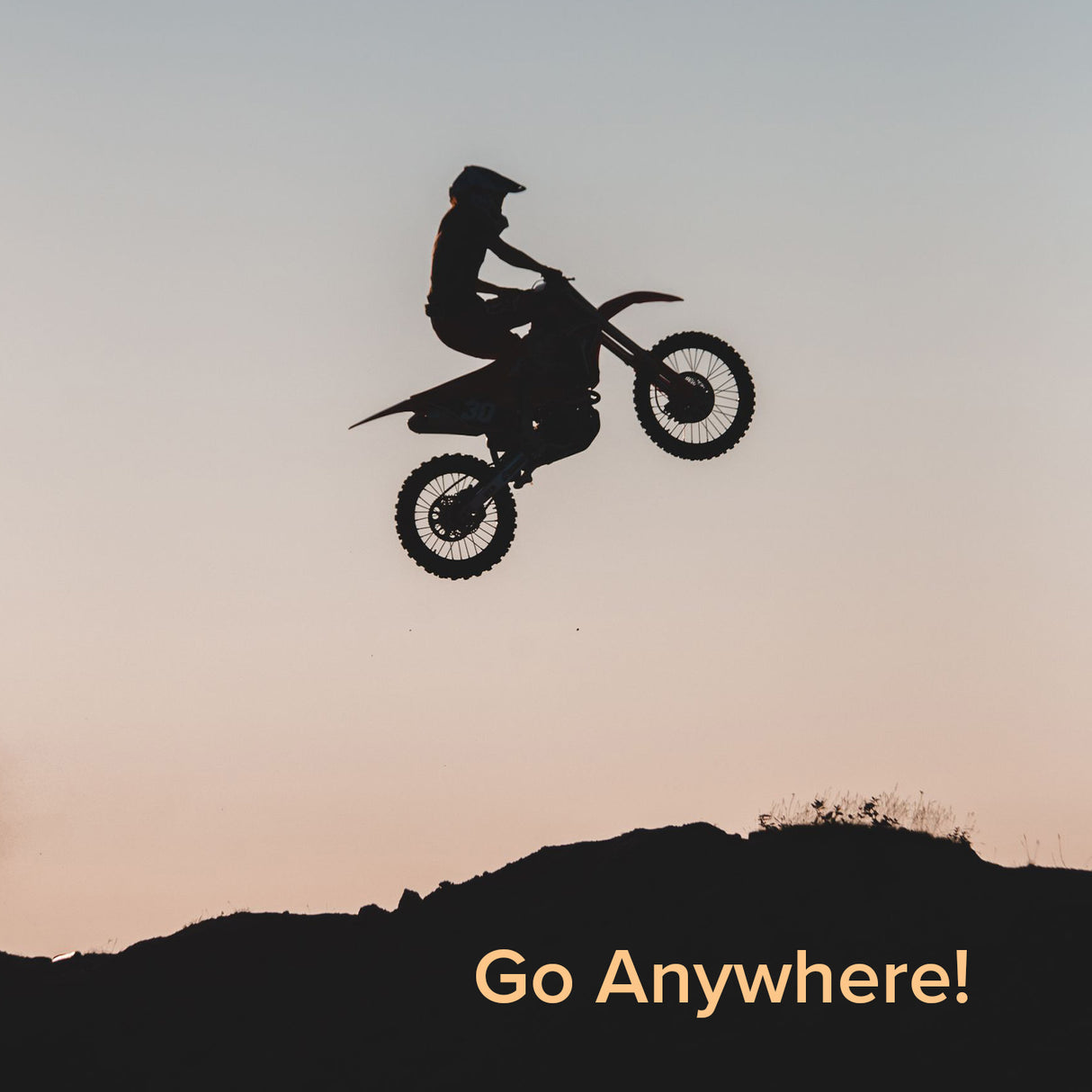 A person performs a jump on a dirt bike equipped with a 3.00-12 (80/100-12) Tire with JK620 Knobby Tread, suitable for Baja, Coolster, and Honda Dirt Bikes.