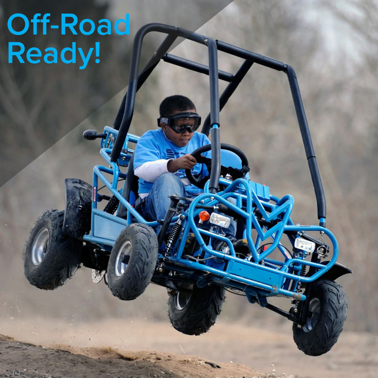 145/70-6 Front Tire with V-Tread for Coleman KT196 & CK196 Go-Karts, featuring an aggressive V-tread pattern, mounted on a go-kart driven by a boy wearing goggles.