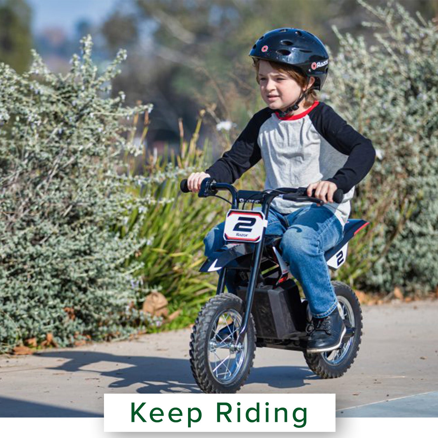 Child riding a small Razor MX125 Dirt Rocket bike outdoors, showcasing the 12 Volt 5 Ah Battery for optimal performance.