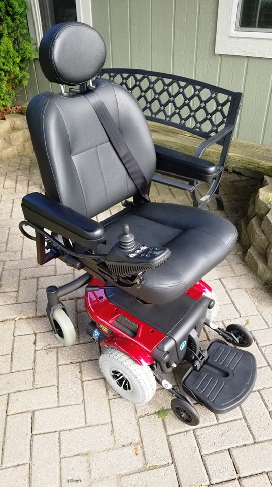 3.00-4 (10x3, 260X85) Foam-Filled Mobility Tire (2-5/8 Bead Width) with Durotrap C9210 Tread attached to a wheelchair on a brick surface.