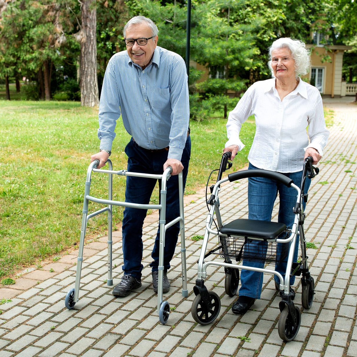 A man and woman using the Drive Medical Durable 4-Wheel Rollator (10257) with hand brakes and comfortable loop handles.