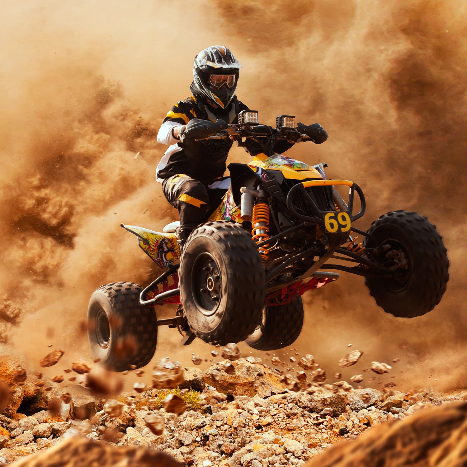 Person performing a high jump on a quad bike, highlighting the rugged, durable #40/41/420 Chain - 60 Tooth Rear Sprocket for Mini Bikes, designed for heavy-duty trail and suburban use.