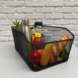 Market-Style Rear Basket for Bicycles (Axiom) filled with assorted food items, including a can of coconut water, a bottle with a yellow cap, and various fruits and vegetables.