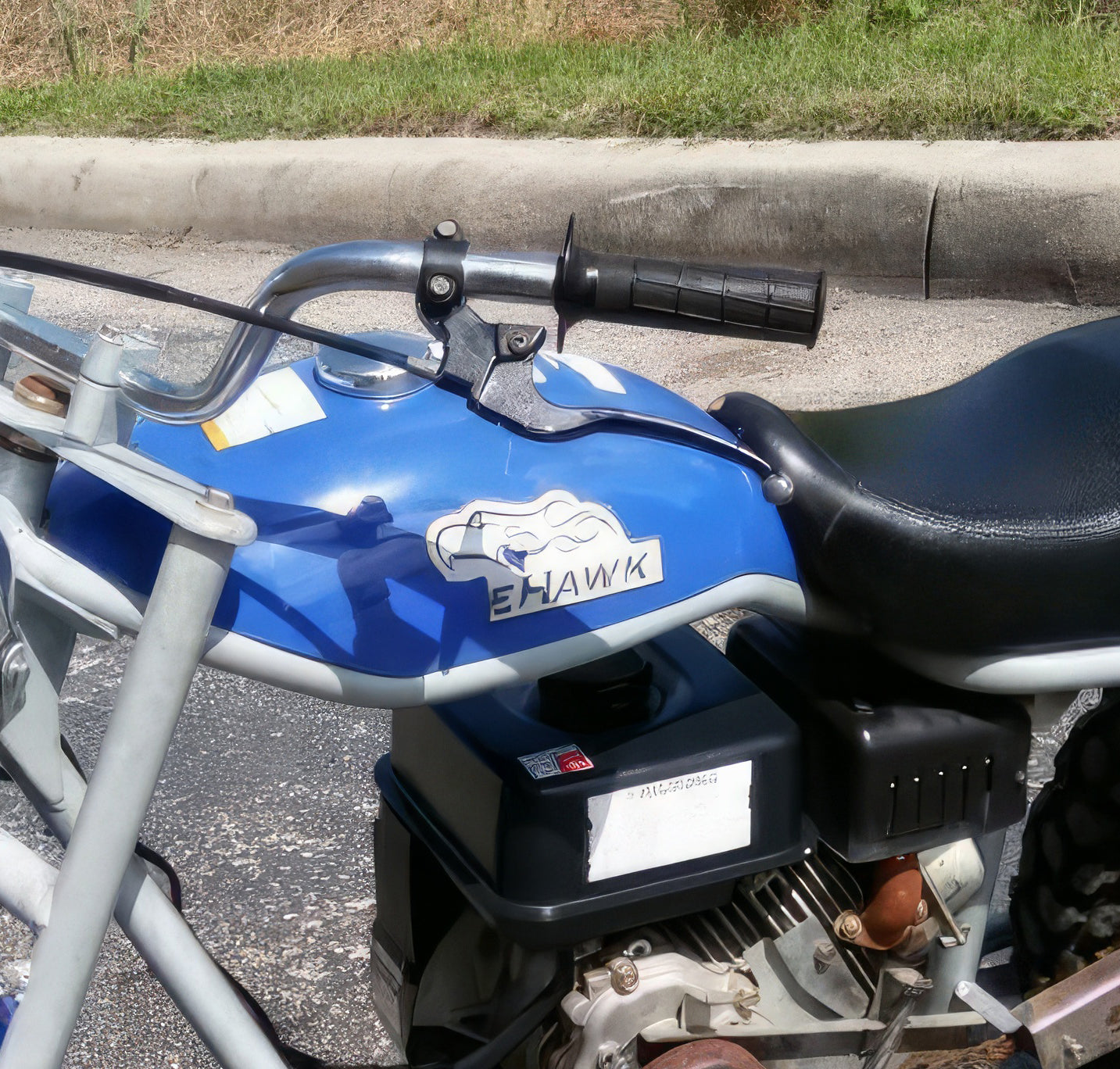 Black left brake lever for the Baja Mini Bike MB165 & MB200, shown in close-up, highlighting its heavy-duty ATV-type design and compatibility with Baja Heat, Mini Baja, and Baja Warrior models.