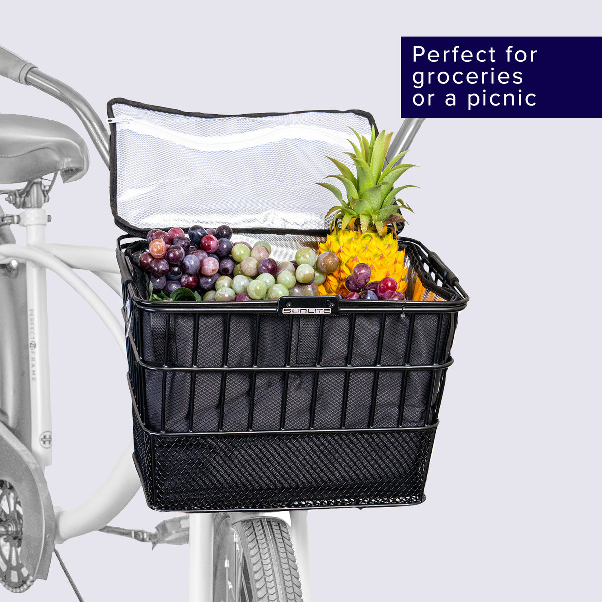 Insulated Basket Bag for Bicycles, E-Bikes, & Scooters: A basket filled with various fruits, mounted on a bicycle, highlighting the bag's spaciousness and utility for carrying items securely.