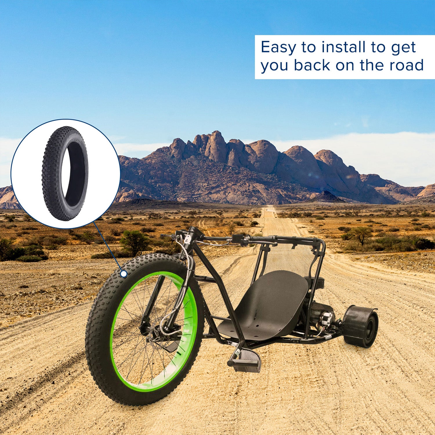 26x4 Knobby Fat Bike Tire on a dirt road, showcasing its thick, rugged treads designed for superior grip and control in off-road conditions, with a mountain backdrop highlighting its all-terrain capability.