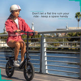 Woman riding a scooter with a focus on the wheel, showcasing the 14x2.125 Inner Tube with Angled Valve Stem, emphasizing the practical design for easy access and efficient inflation.