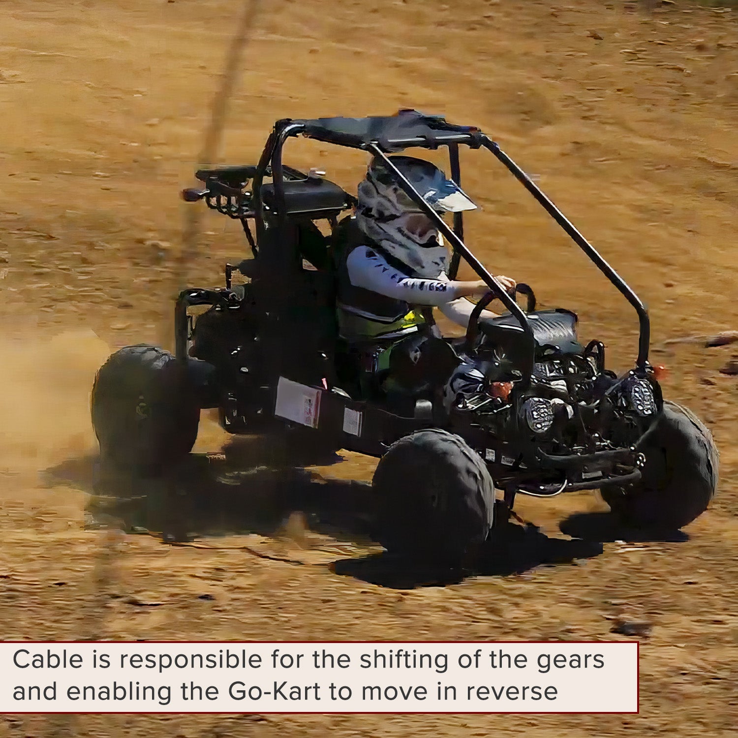 41 Gear Shift Reverse Cable with Clevis Ends for the TaoTao GK110 Go-Kart, featuring a 35 sleeve length and 1.57 clevis ends, visible amidst a go-kart scene with a person driving.