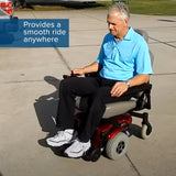 Man sitting on a motorized wheelchair, showcasing the 8x2 (200x50) Rear Caster Wheel Assembly for Jazzy 1101, 1120, 1121, 1122, 1400, and Jazzy Select 14/14XL Power Chairs.