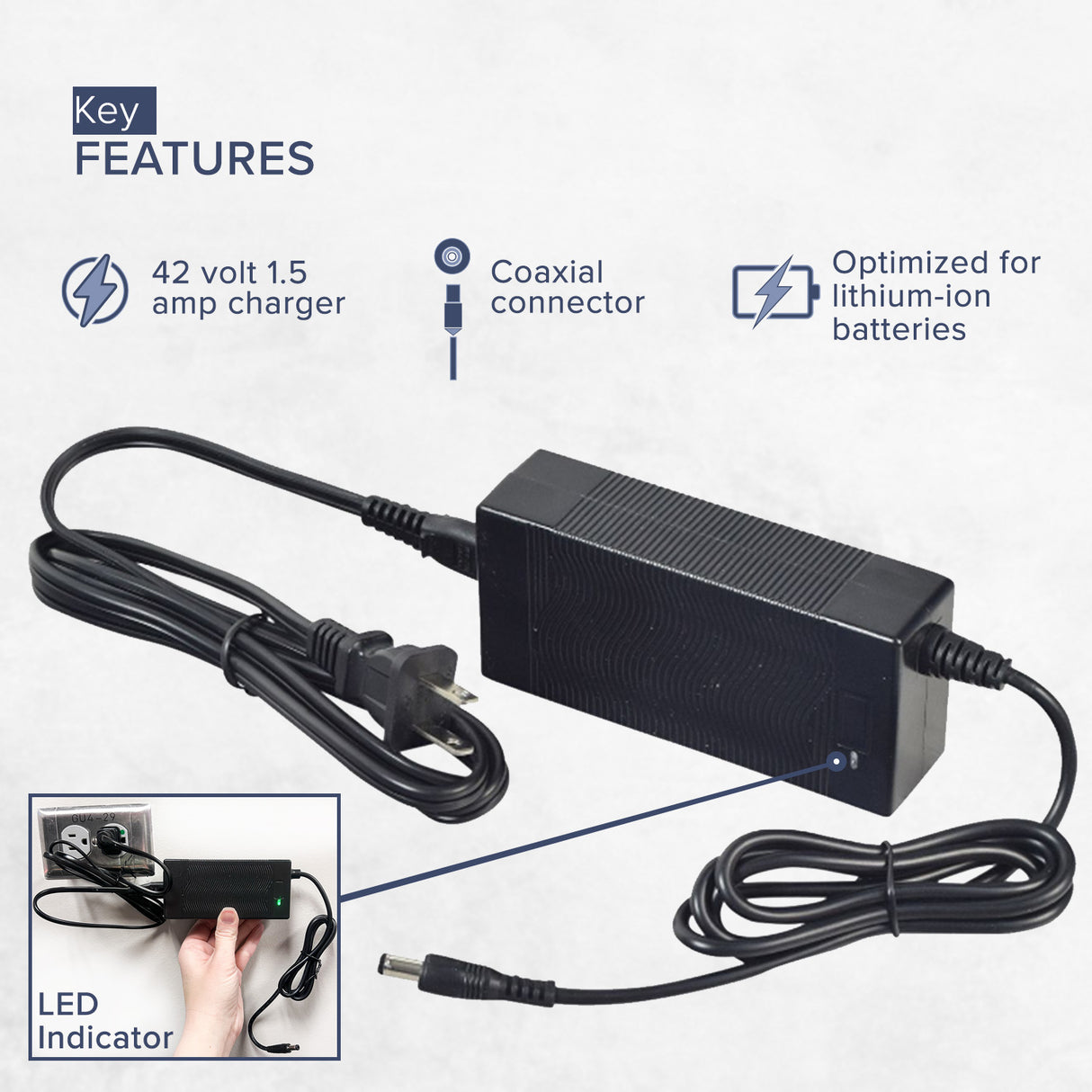 42 Volt Charger for Jetson® Bolt & Bolt Pro Electric Bicycles, featuring a black power cord with a blue indicator light and a coaxial connector, held by a hand for a clear view.