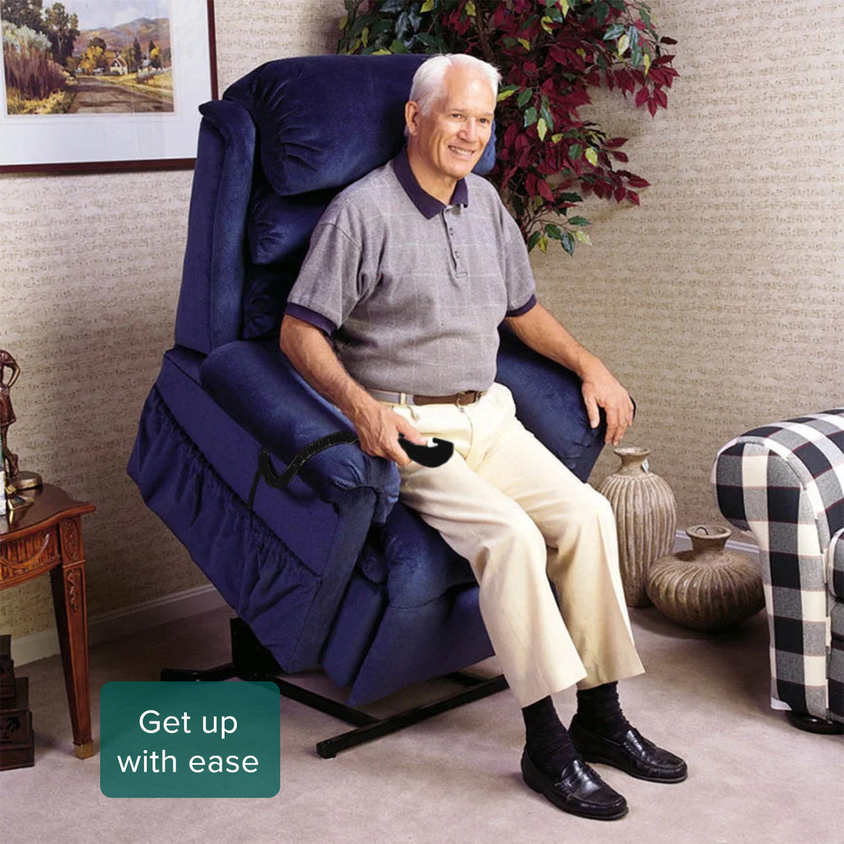 Man seated comfortably in a recliner, holding a remote. The image illustrates the Hand Control Assembly & Control Box with Heat & Massage for Pride & Mega Motion Lift Chairs in use.