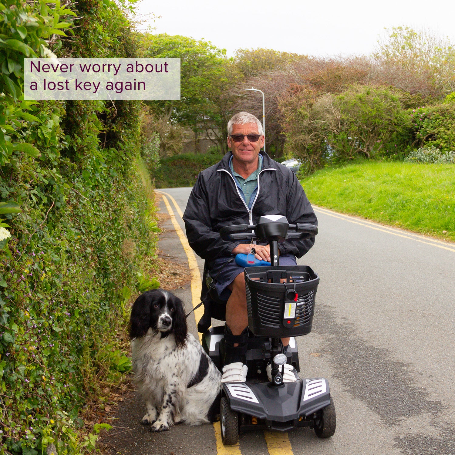 A man riding a scooter with a dog on a road, highlighting the Key for the Drive Bobcat, Scout DST, & Spitfire Scout & Spitfire Scout DLX Scooters.