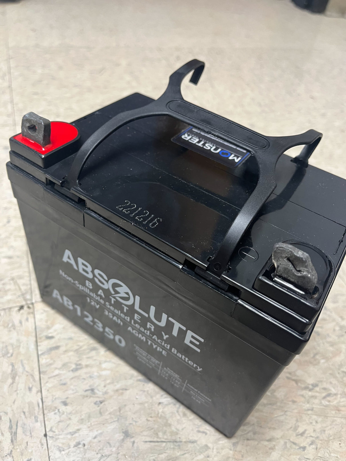 U1 (35 Ah) 12 Volt UB12350 AGM Mobility Scooter & Power Chair Battery with Post Terminals, featuring a black handle and compact design, ideal for reliable power in mobility devices.