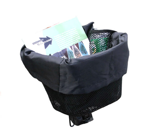 Basket Carry Tote for Mobility Scooters pictured inside a scooter basket with a drawstring closure, a book, and a bag, highlighting its compatibility and durable, easy-to-clean nylon material.