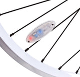 Close-up of a Bicycle Spoke Light attached to a bicycle wheel, highlighting its clear, circular design, perfect for enhancing visibility and safety on bikes and scooters.