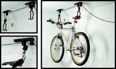 Bicycle Storage Hoist with Clamp securely suspends a white bicycle with black tires from the ceiling, showcasing a close-up of the wheel, hook, and cable mechanisms.