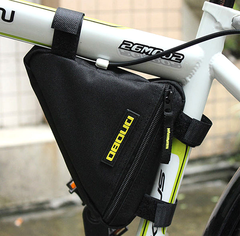 All-Black Frame Mount Triangular Bicycle Storage Bag attached to a white bicycle frame, showcasing its compact, triangular shape designed for conveniently storing small personal items during rides.