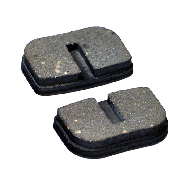 Disc Brake Pads for the Realtree RT100 Mini Bike (Set of 2) featuring two rectangular pads with holes, designed for mini bikes with disc brakes. Each pad measures approximately 1-1/8 x 3/4.