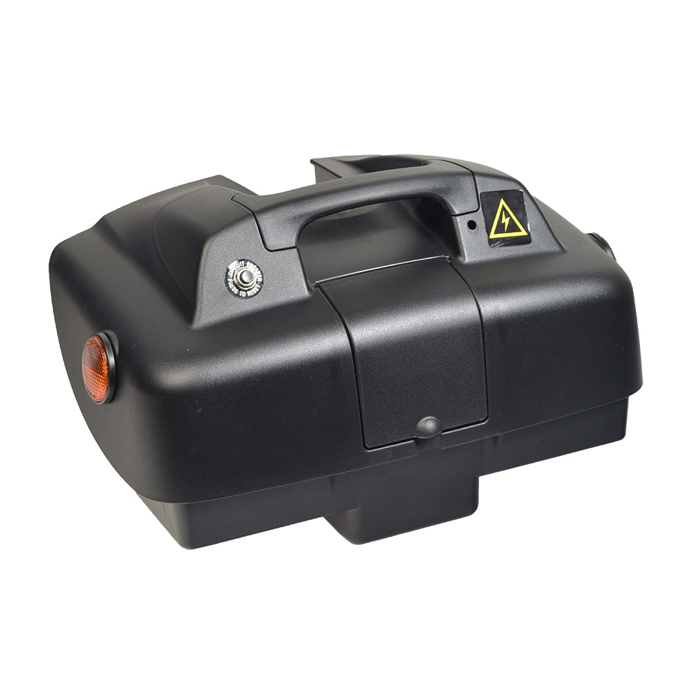 24 Volt Battery Box for the C.T.M. HS-1500 featuring a black box with a yellow warning triangle, reflective elements, a handle, and a button for easy removal and replacement.