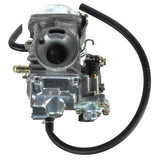 Close-up of a carburetor for the Baja Phoenix 250 (PX250) motorcycle, highlighting intricate metal components and structure. Suitable for models with VIN prefix LUAH, previously sold by Pep Boys.