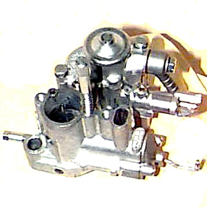 Close-up of a 20/20 oil-injected carburetor (LF/SI) for Vespa VNX, VLX, and VSD scooters, showing intricate metal gears and levers essential for vintage Vespa engine performance.