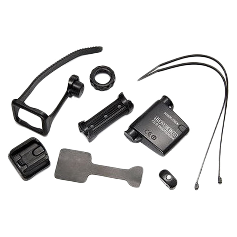 Accessory Kit for the CC-VT210 Velo Wireless Bike Computer, featuring a black device with white text, attached wires, a speed sensor, bracket, and wire ties.