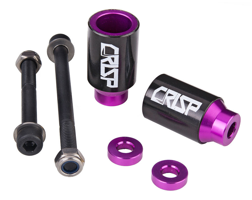 Crisp Chromo Sleeved Peg Set for Kick Scooters features black cylindrical pegs with white text and a screw, made of anodized aluminum alloy core and 4130 chromoly steel sleeves.