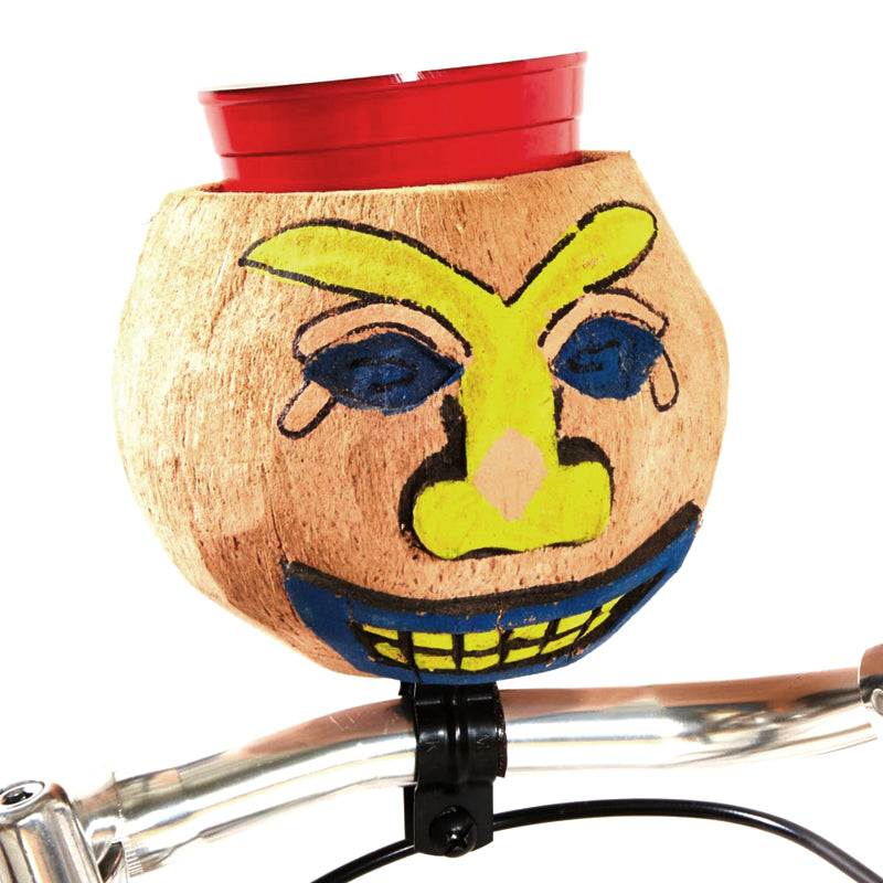 Cruiser Candy Coconut Cup Holder featuring a hand-painted tiki face on a hollowed coconut, mounted on a bicycle handlebar, blending beachcomber style with functional cup and bottle carrying.