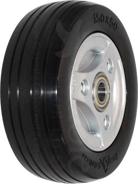 Black 2.50-3 (210-65) Caster Wheel for Permobil F3 Corpus, F5 Corpus, & M5 Corpus Power Chairs, featuring a solid flat-free tire on a silver split rim with a black plastic center cap.