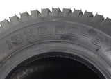 Close-up of the 13x6.50-6 Black Pneumatic Mobility Tire, showcasing its knobby tread pattern. Ideal for Pride Wrangler 4-wheel mobility scooters, offering options with or without 90-degree angled valve stem inner tubes.