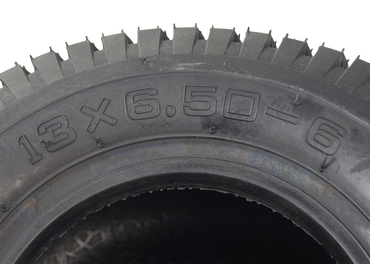 Close-up of the 13x6.50-6 tire for Murray go-karts, showcasing the tread pattern and rubber texture, ideal for dune buggies, ATVs, and karts.