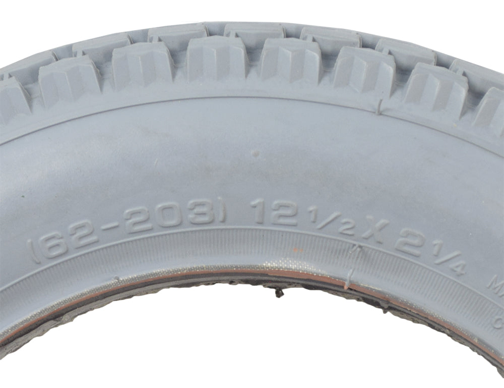 12-1/2x2-1/4 Foam-Filled Mobility Tire with C628 Knobby Tread; close-up showing grey rubber with detailed tread, suitable for mobility scooters and power chairs, non-marking, no inner tube needed.