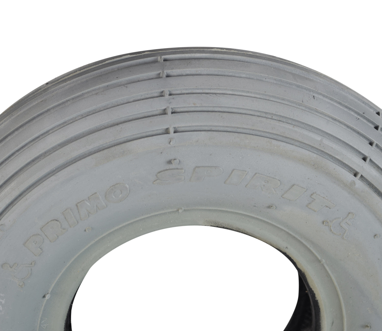 Close-up of 2.80/2.50-4 (9x3) Pneumatic Mobility Tire with C179G Spirit Ribbed Tread, highlighting its non-marking gray rubber and detailed ribbed pattern, ideal for indoor and outdoor use.