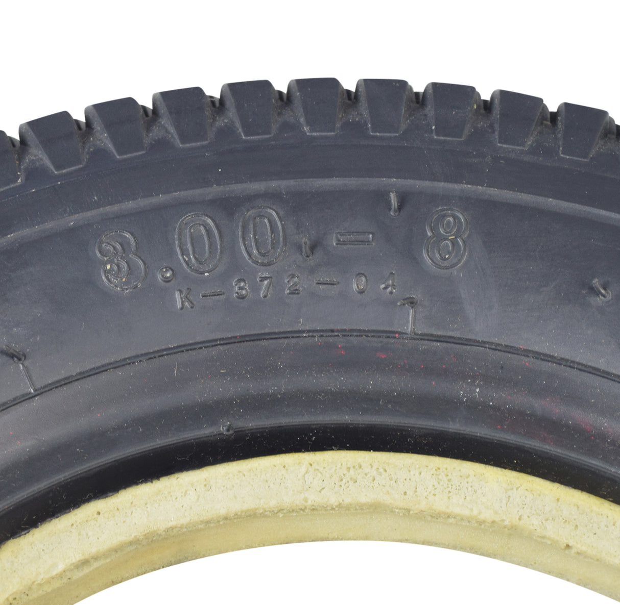 14x3 (3.00-8) black pneumatic mobility tire with K372 Turf tread pattern, close-up showing detailed tire treads and narrow lip profile.