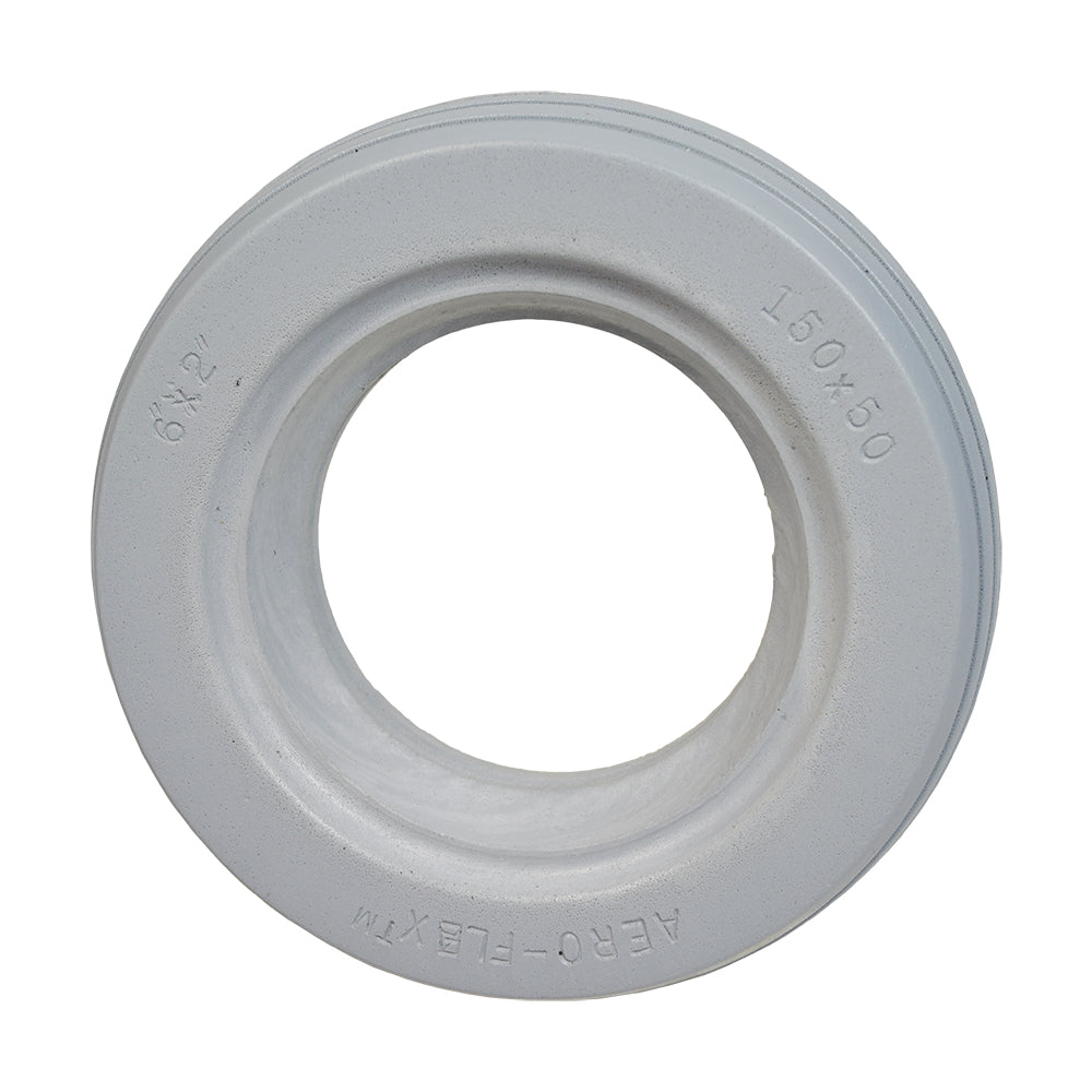 6x2 (150x50) AeroFlex Solid Urethane Mobility Tire with 4-Rib Tread, featuring a white circular design with a central hole, suitable for wheelchairs, providing flat-free dependability and enhanced traction.