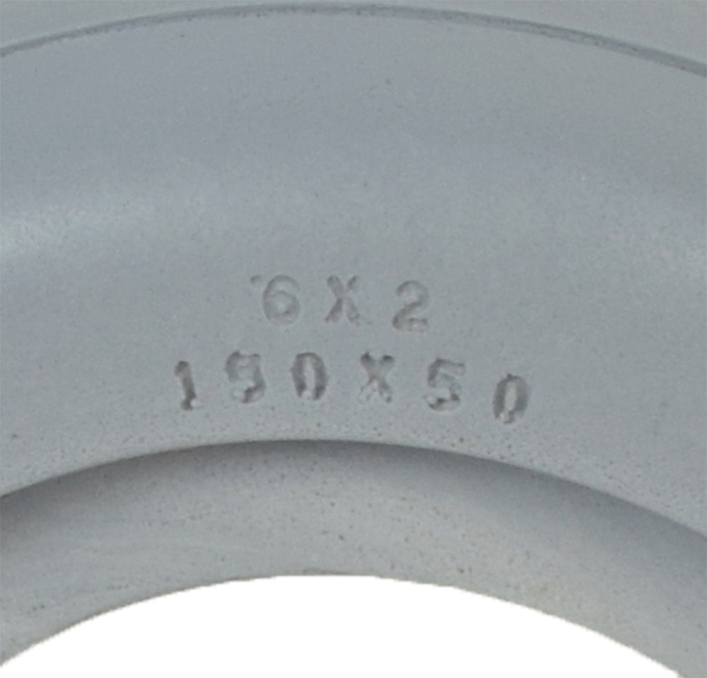 Close-up of a 6x2 AeroFlex Light Gray Solid Urethane Mobility Tire with 2-Rib Tread, highlighting its smooth, solid design and ribbed pattern for wheelchairs.