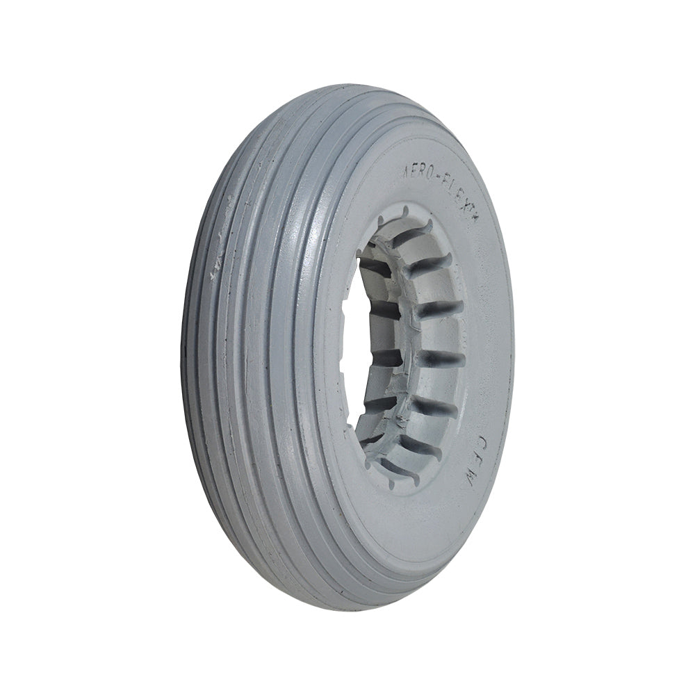 7x2 Light Gray Solid Urethane Mobility Tire with Ribbed Tread, featuring a central hole and flat-free design, ideal for dependable mobility use.