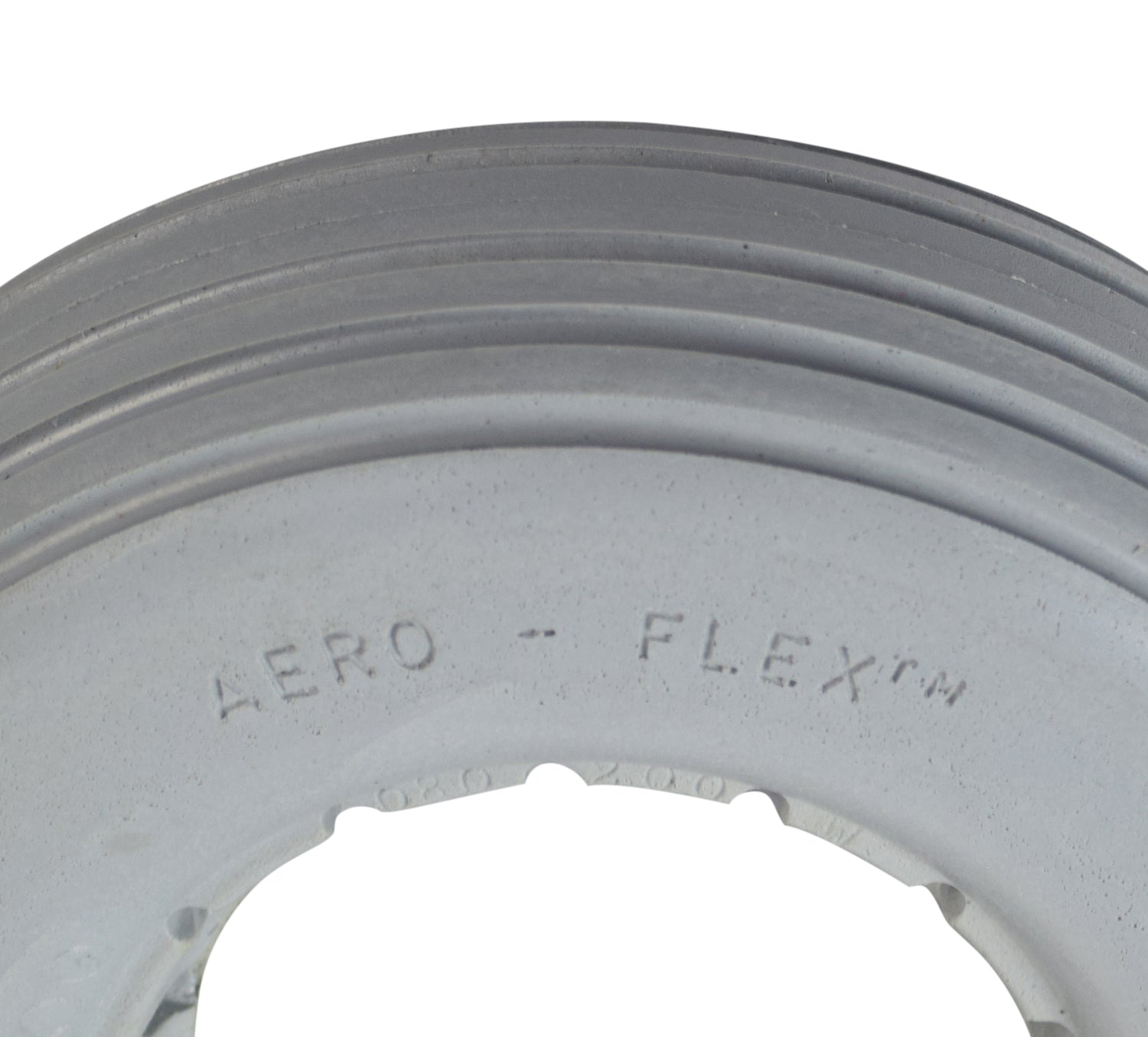 Close-up of the 8x2-1/4 Light Gray Solid Urethane Mobility Tire with Ribbed Tread, showcasing its durable, flat-free design, perfect for various terrains, and latex-free solid urethane material for two-piece wheel assembly.