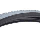 Close-up of the 24x1-3/8 Gray Pneumatic Wheelchair Tire with C763 Tread, showcasing its knobby tread pattern and durable non-marking gray rubber for versatile indoor and outdoor use.