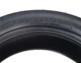 Close-up of a 100/80-10 Tubeless Pneumatic Front Tire for the Drive Medical King Cobra Mobility Scooter, featuring a shallow street tread for a smooth ride on hard surfaces.