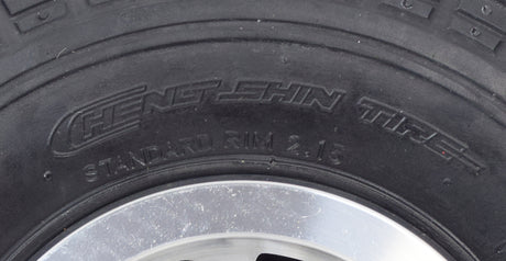 Close-up of the 3.00-4 (10x3, 260x85) Solid Front Wheel Assembly for the Drive Daytona 3 GT Mobility Scooter, highlighting the robust tread pattern and durable synthetic rubber construction.