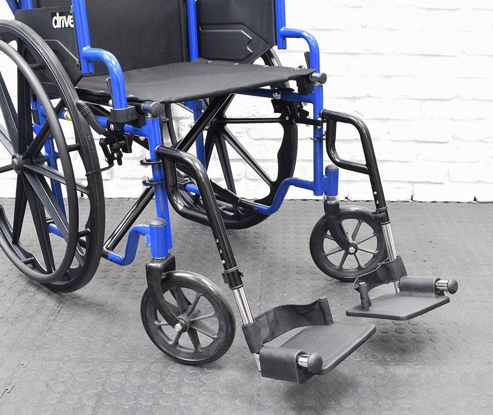 Swing-Away Footrest & Leg Rest Assembly for Wheelchairs (Set of 2) showing adjustable leg rests with removable heel loops and multiple push-in ball detent holes on a Drive Medical style wheelchair.