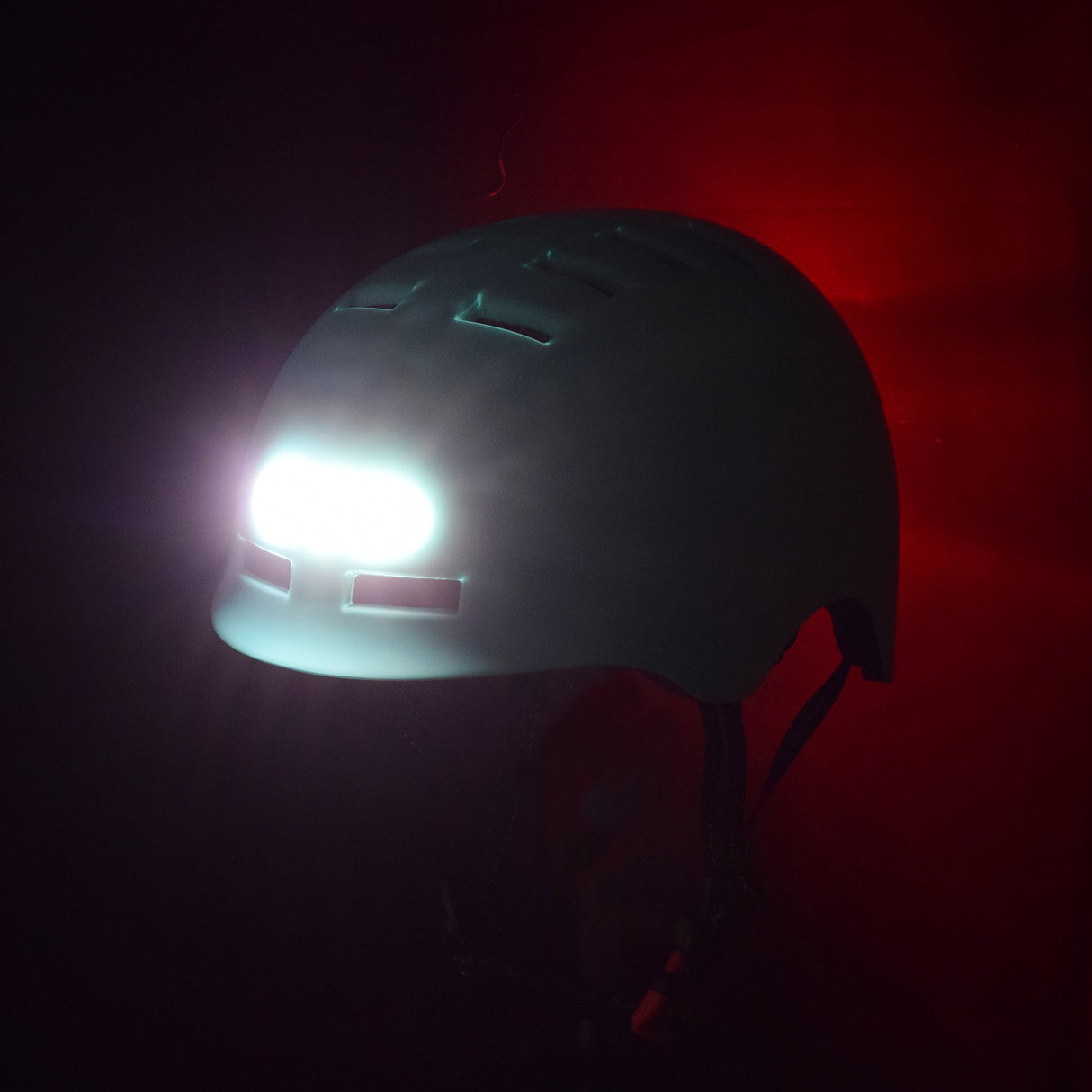 Dual Light-up Helmet for Bikes & Scooters with a white 3-LED headlight and a red 10-LED taillight, featuring an impact-resistant hardshell exterior and adjustable size.