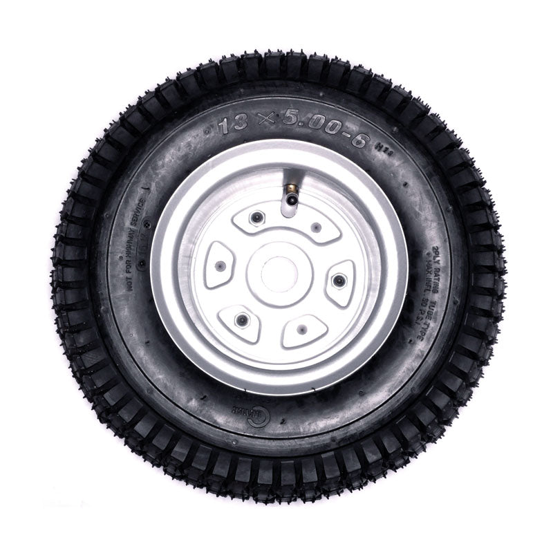 Razor Dirt Quad Rear Wheel Assembly (Versions 1 - 18), showcasing a black tire with a silver rim, designed for durability and compatibility with specified Razor Dirt Quad models.