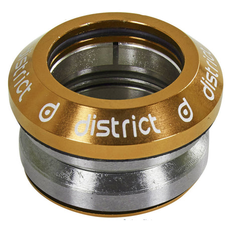 Close-up of the District S-Series Standard Headset for Kick Scooters, featuring a circular metal design with a laser-etched logo, showcasing its integrated, high-precision, smooth-spinning components.