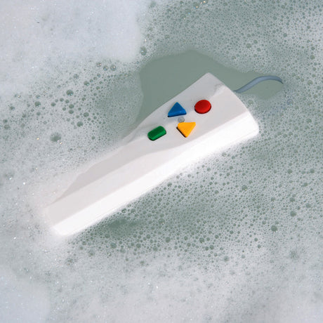 Drive Medical Bellavita Bath Lift Hand Control (460900600) with Batteries, shown floating in a bathtub with soapy water, highlighting its waterproof design and easy accessibility.