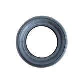 110/50-6.5 Pocket Bike Tire with KF873 Slick Tread. A close-up of a treadless black racing tire designed for the X-Treme XP-700, XP-489, and other pocket bikes, showing its smooth, tubeless design.