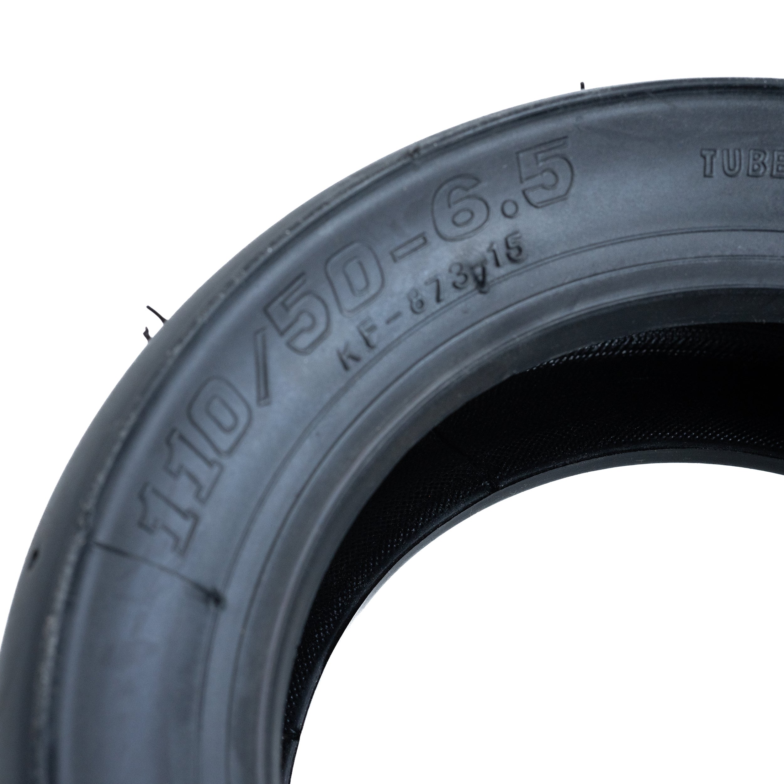 Close-up of a 110/50-6.5 Pocket Bike Tire with KF873 Slick Tread, showcasing the treadless racing design suitable for X-Treme XP-700 and XP-489 models, highlighting its tubeless pneumatic construction.