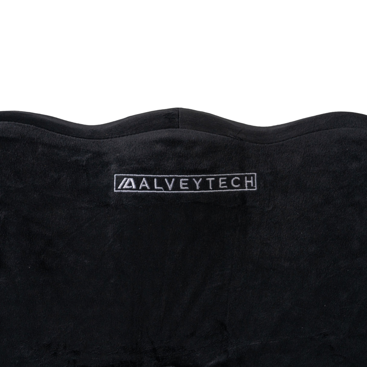 Deluxe Ergonomic Gel Seat Cushion for Wheelchairs and Scooters with black suede cover, featuring a logo. The cushion has a contoured design with slightly raised sides for added comfort and stability.