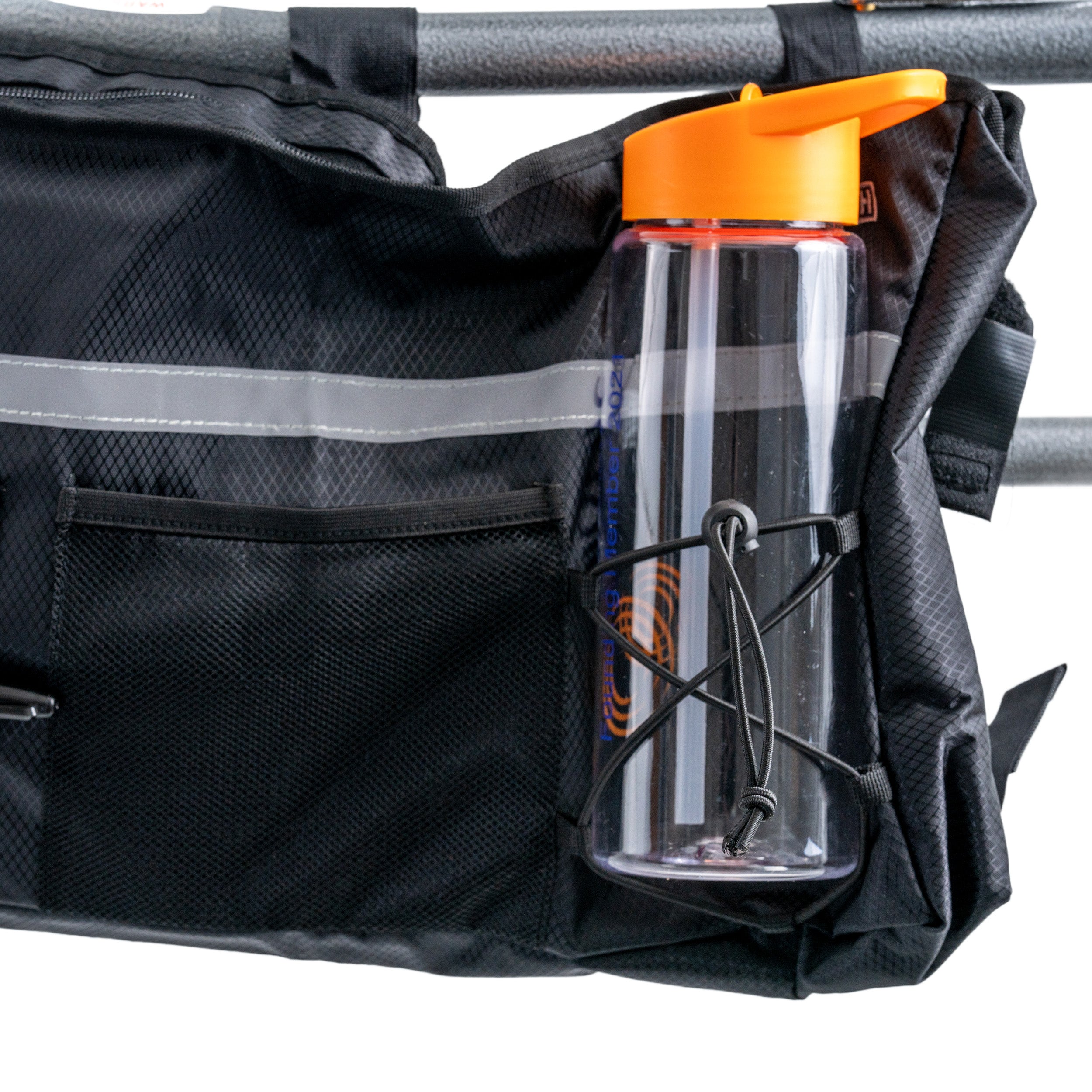 Super Deluxe Universal Walker & Rollator Bag, water bottle on top, shown mounted on a black bag with multiple pockets, demonstrating the bag's spacious design and convenient carrying capacity.